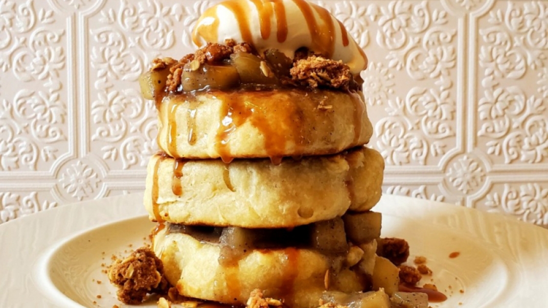 stack of extra thick pancakes with various toppings