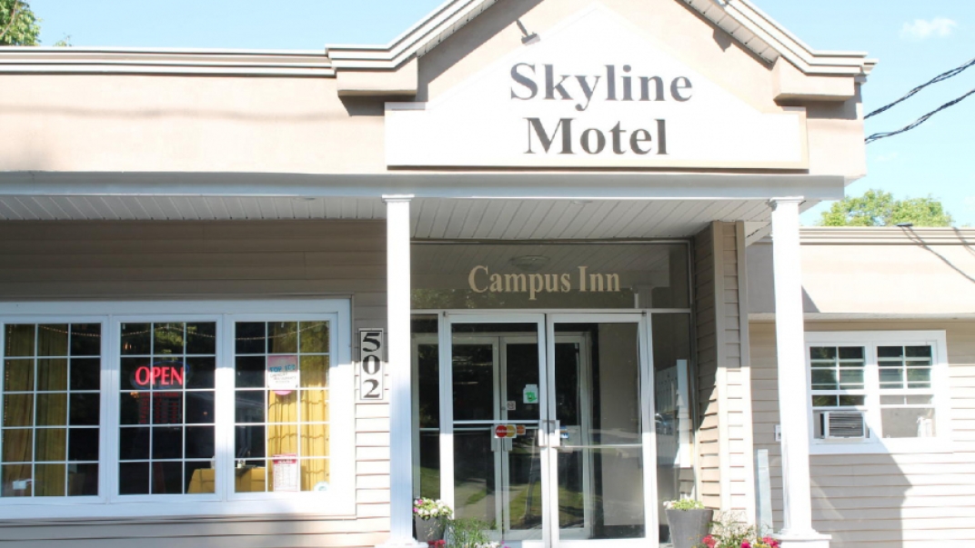 skyline motel building and a blue sky