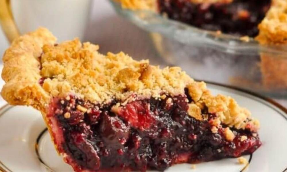 cherry pie on a plate with gold detailing