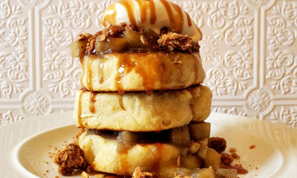 stack of extra thick pancakes with various toppings