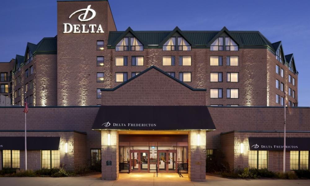 Delta Fredericton at night with welcoming lighting.