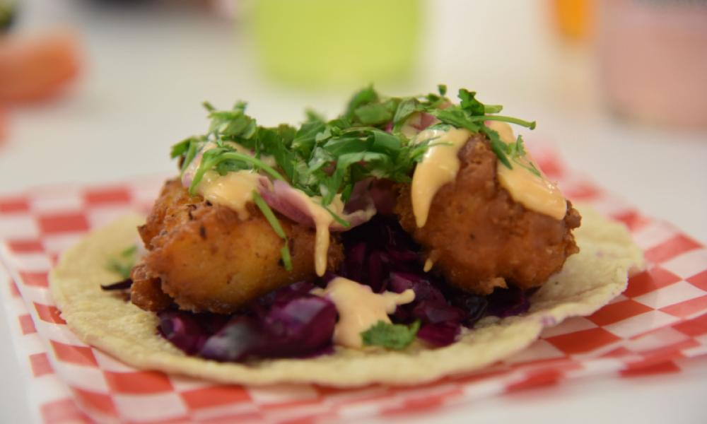 open face taco on checkered parchment paper
