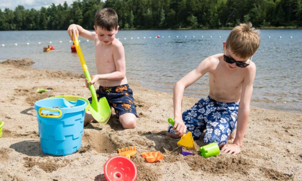 Two boys playing in the sand