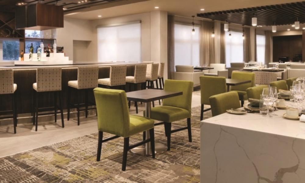 restaurant with white a green chairs