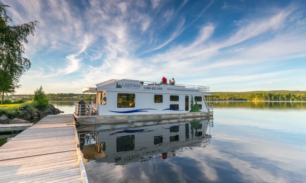 Docked houseboat by a lake