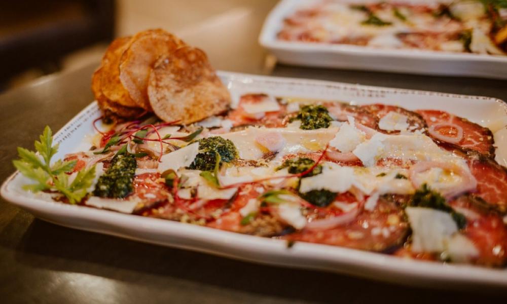plate of appetizers with meat and cheese