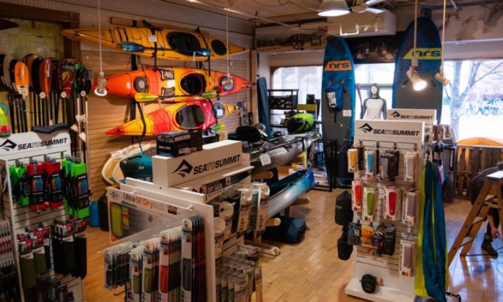 Outdoor gear for sale on store shelves, walls and displays